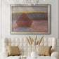 Impressionist haystack sunset scene in winter by Claude Monet in an ornate champagne frame displayed in a neutral-toned interior setting.