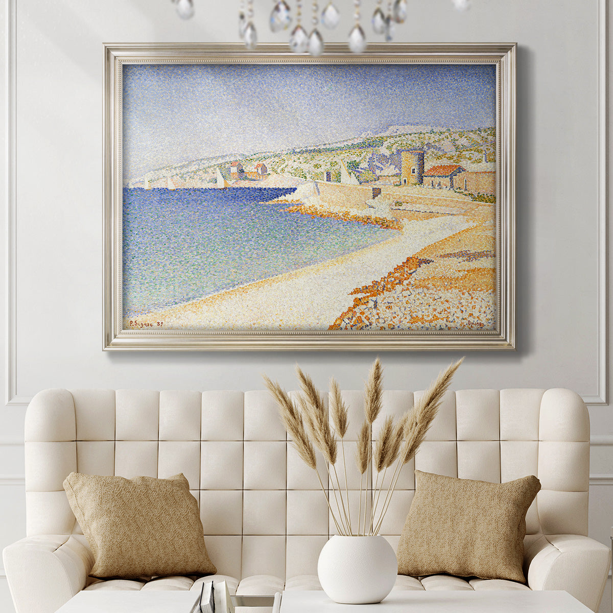 Impressionist Mediterranean jetty seascape by Paul Signac in an ornate champagne frame displayed in a neutral-toned interior setting.