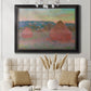 Impressionist haystack series landscape by Claude Monet in an ornate black frame with gilded inner detail displayed in a neutral-toned interior setting.