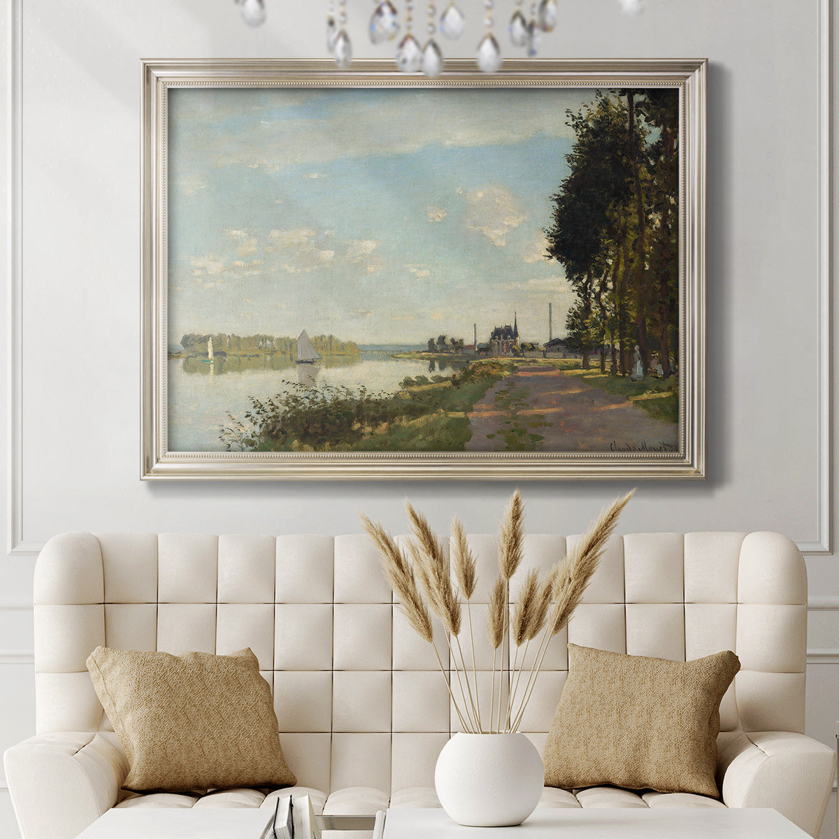 Impressionist river scene with red boats by Claude Monet in an ornate champagne frame displayed in a neutral-toned interior setting.