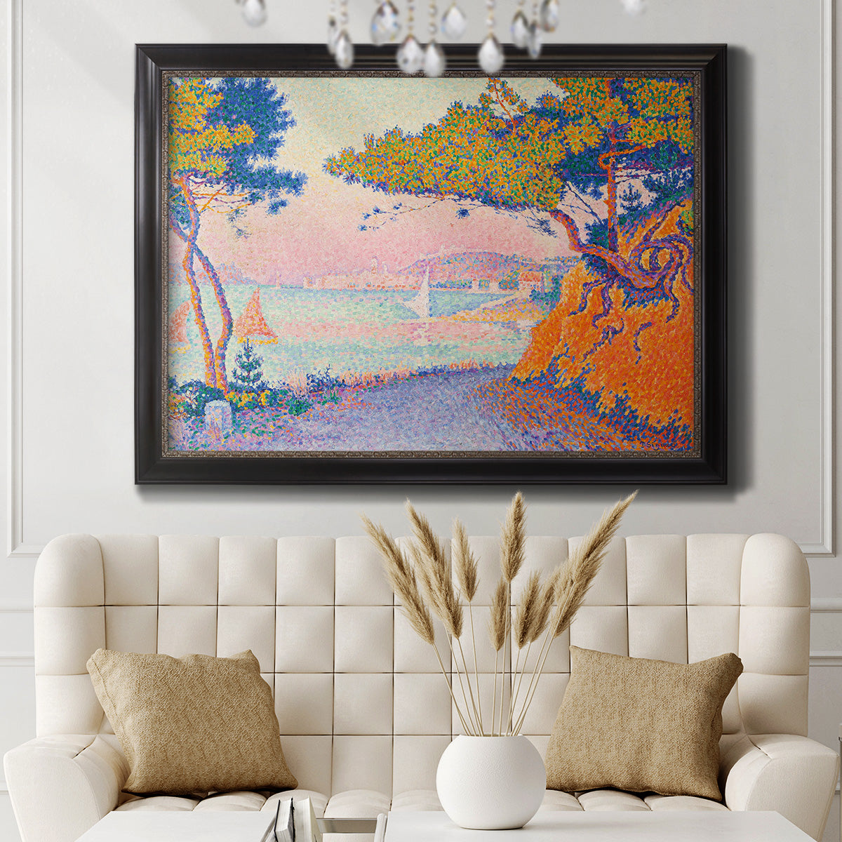 Pointillist coastal seascape by Paul Signac in an ornate black frame with gilded inner detail displayed in a neutral-toned interior setting.