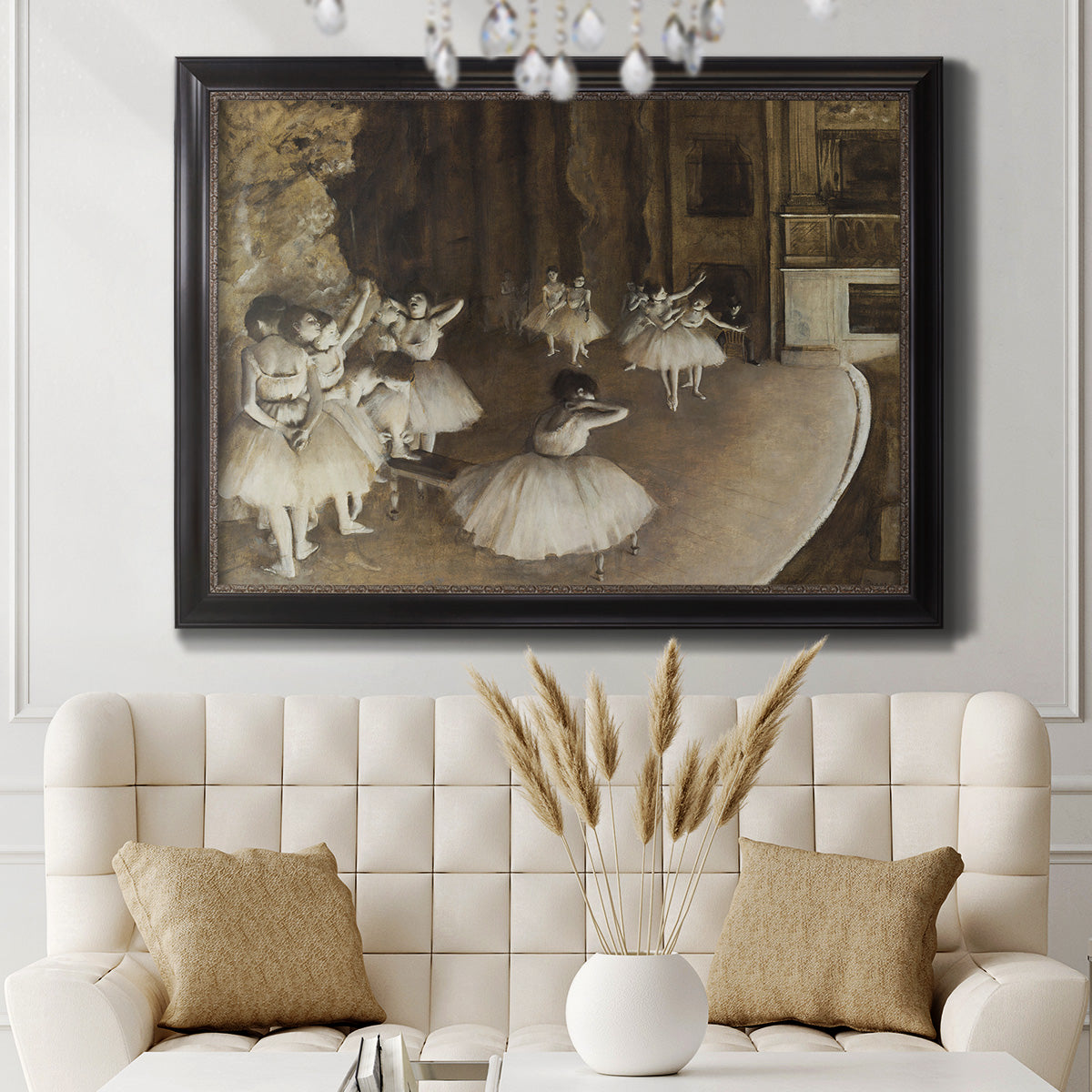 Impressionist ballet rehearsal scene by Edgar Degas in an ornate black frame with gilded inner detail displayed in a neutral-toned interior setting.