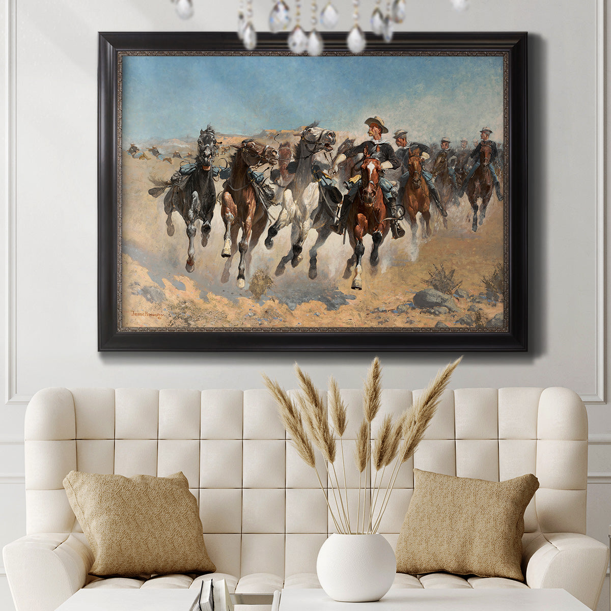 Impressionist western action scene by Frederic Remington in an ornate black frame with gilded inner detail displayed in a neutral-toned interior setting.