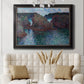 Impressionist rocky seascape by Claude Monet in an ornate black frame with gilded inner detail displayed in a neutral-toned interior setting.