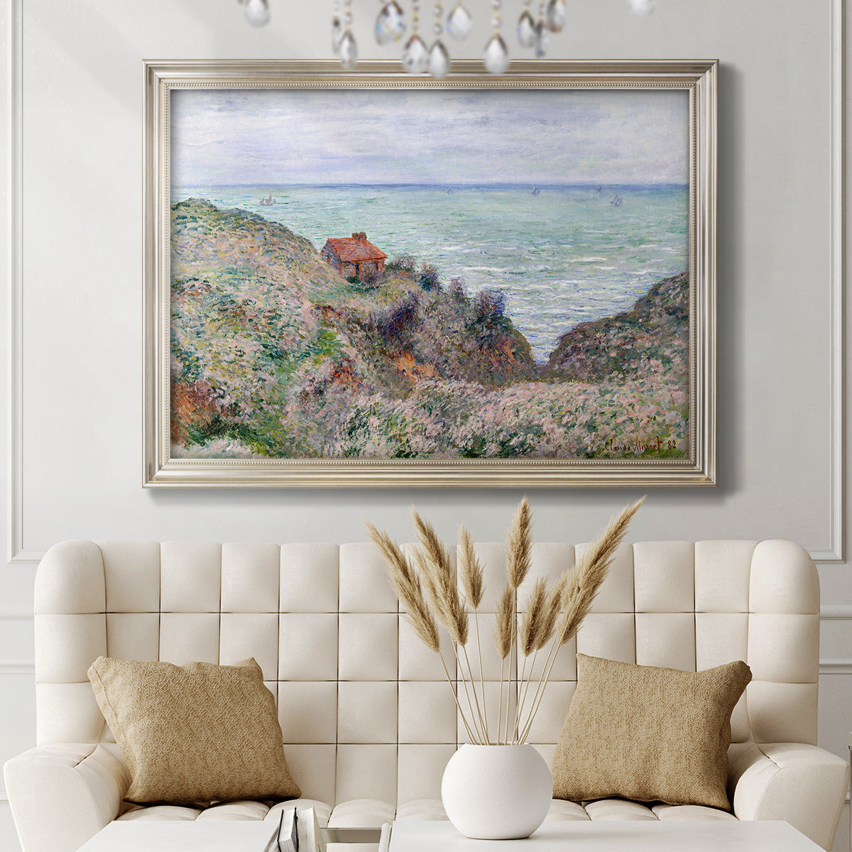Impressionist coastal watch cabin scene by Claude Monet in an ornate champagne frame displayed in a neutral-toned interior setting.