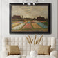 Impressionist Dutch bulb field landscape by Vincent van Gogh in an ornate black frame with gilded inner detail displayed in a neutral-toned interior setting.