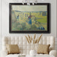 Impressionist rural hay harvest landscape by Camille Pissarro in an ornate black frame with gilded inner detail displayed in a neutral-toned interior setting.