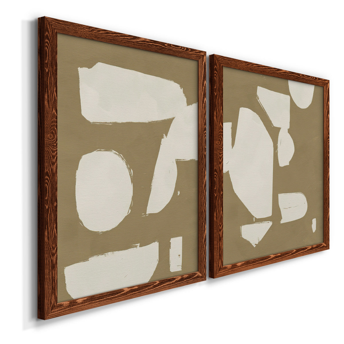 Angled view of a set of two maple barnwood framed canvas prints featuring two bold minimalist shape abstracts featuring irregular white cutout-like shapes on taupe grounds.