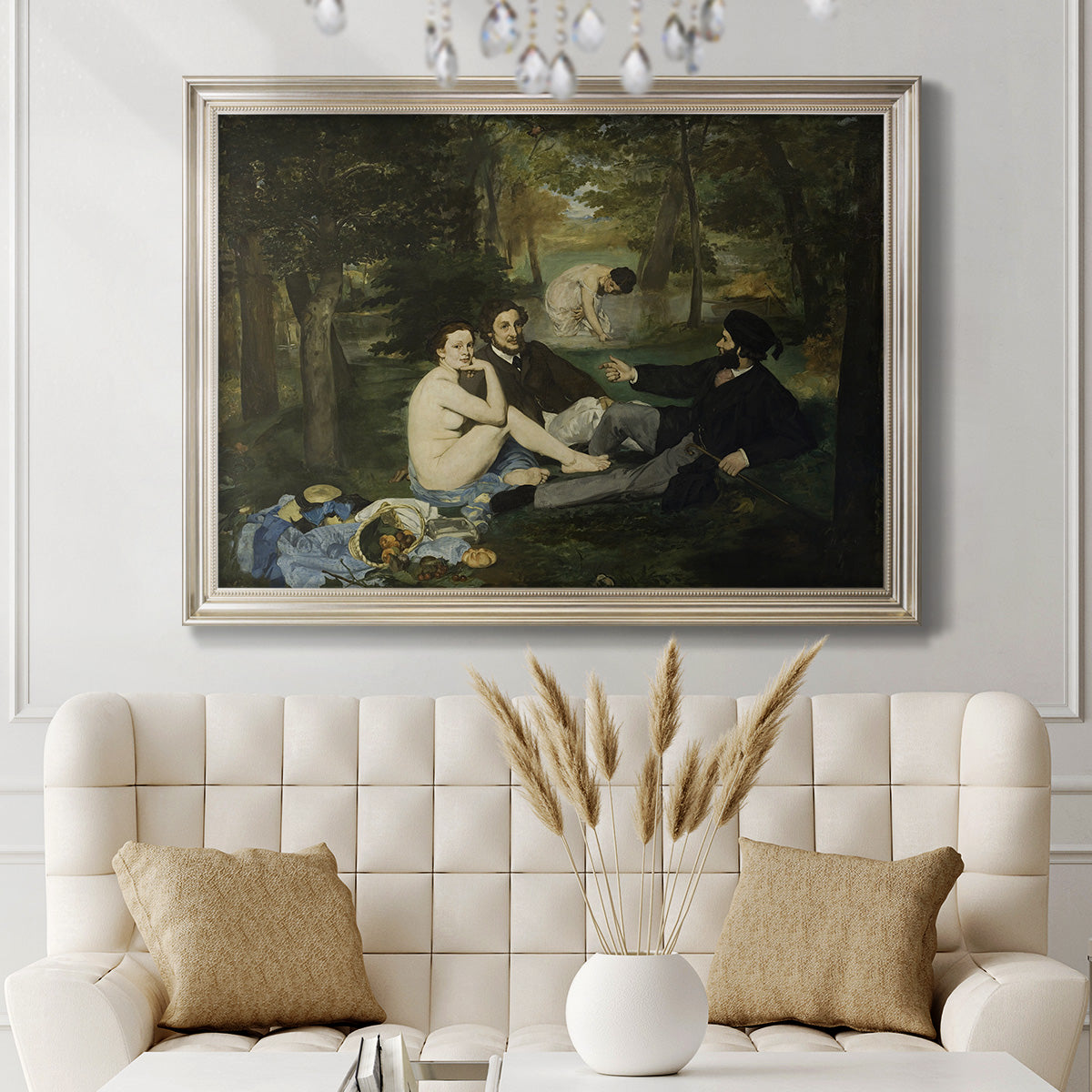 Groundbreaking impressionist picnic scene by Édouard Manet in an ornate champagne frame displayed in a neutral-toned interior setting.