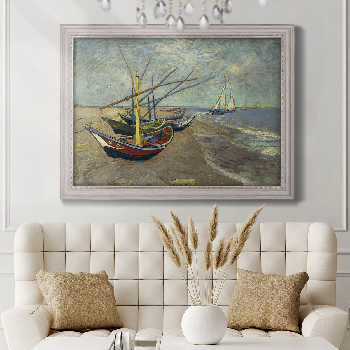 Impressionist coastal fishing boats scene by Vincent van Gogh in an ornate weathered white frame displayed in a neutral-toned interior setting.