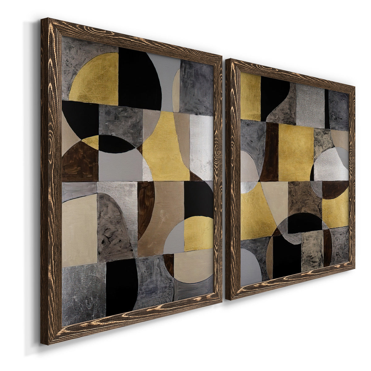 Angled view of a set of two walnut barnwood framed canvas prints featuring two structured modern abstracts featuring interlocking black gray cream and gold geometric sections.