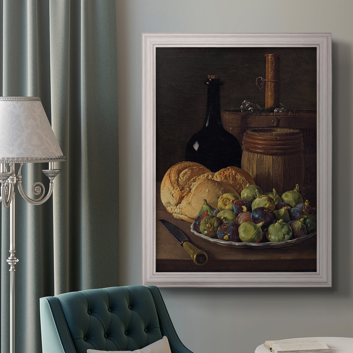 Realist still life with figs and bread by Luis Meléndez in an ornate weathered white frame displayed in a neutral interior setting.