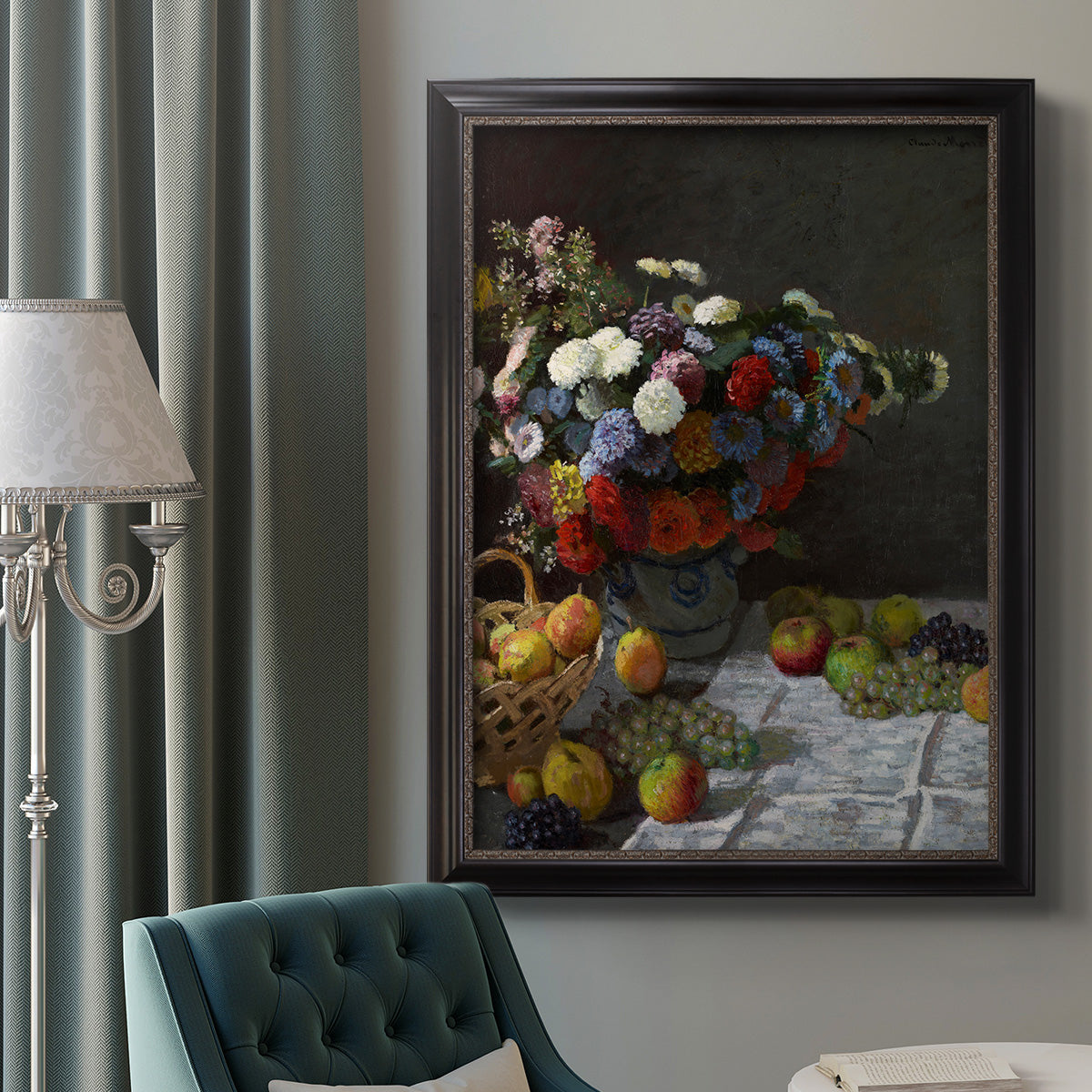Impressionist floral still life painting by Claude Monet in an ornate black frame with gilded inner detail displayed in a neutral interior setting.
