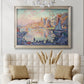 Impressionist Mediterranean harbor painting by Paul Signac in an ornate champagne frame displayed in a neutral-toned interior setting.