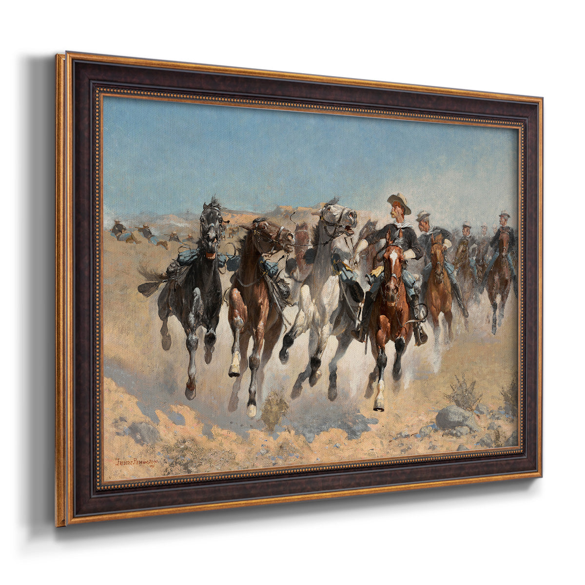 Impressionist western action scene by Frederic Remington printed on canvas in an ornate bronzed mahogany wood frame.