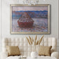 Impressionist single haystack landscape by Claude Monet in an ornate champagne frame displayed in a neutral-toned interior setting.