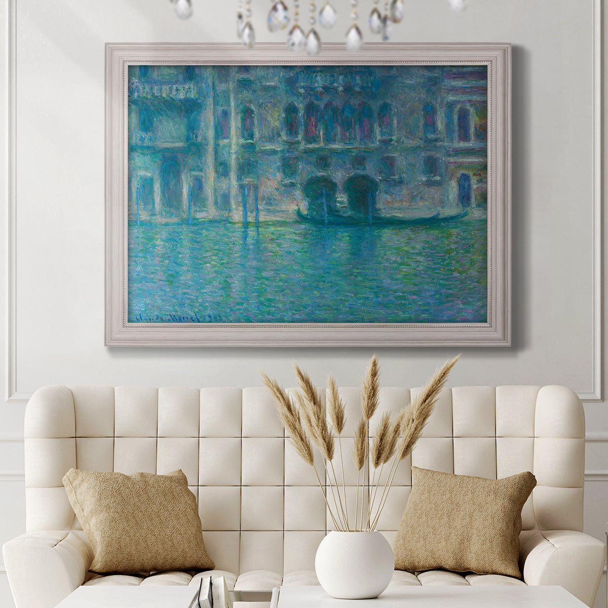 Impressionist Venetian palace waterfront scene by Claude Monet in an ornate weathered white frame displayed in a neutral-toned interior setting.