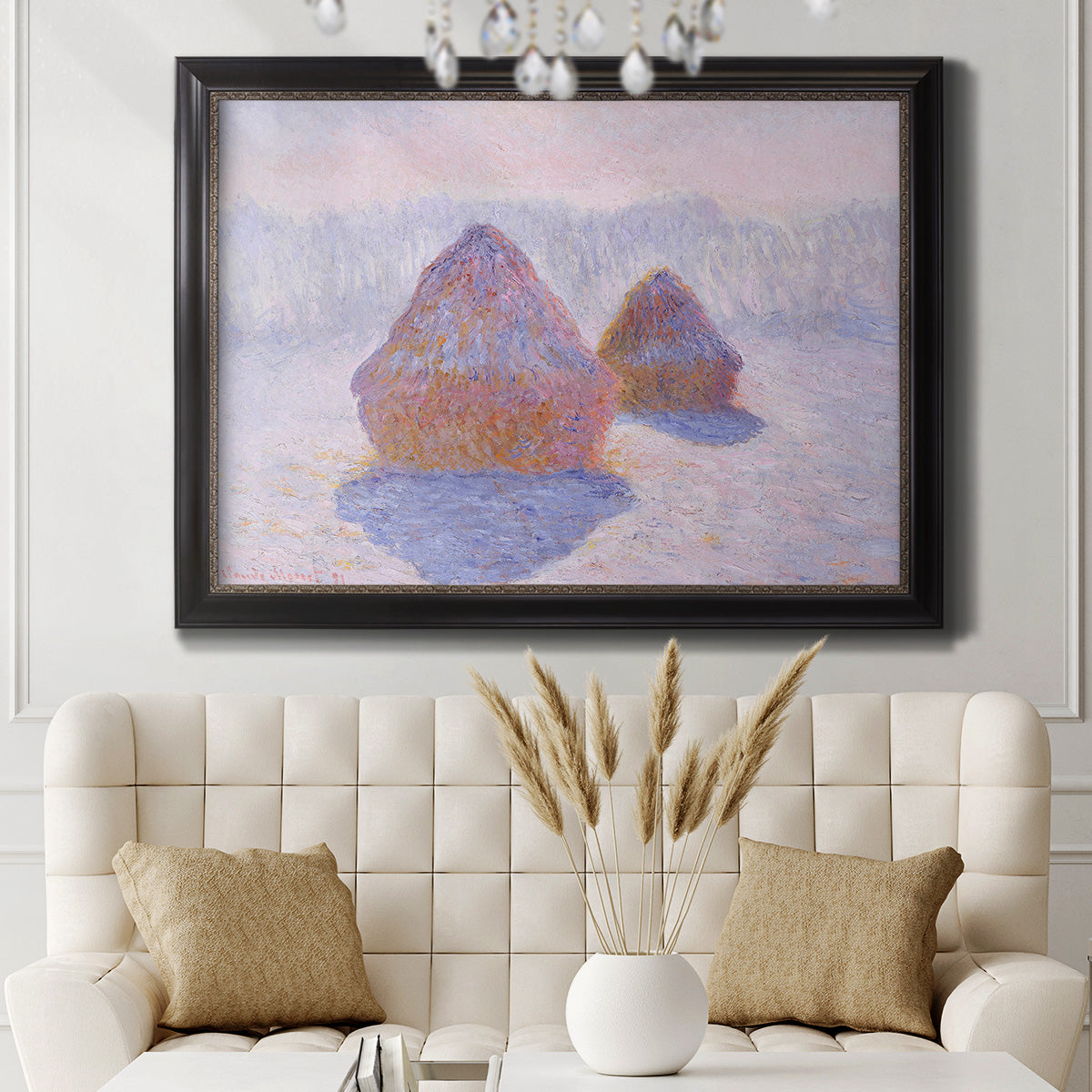 Impressionist winter haystack scene with sunlight by Claude Monet in an ornate black frame with gilded inner detail displayed in a neutral-toned interior setting.