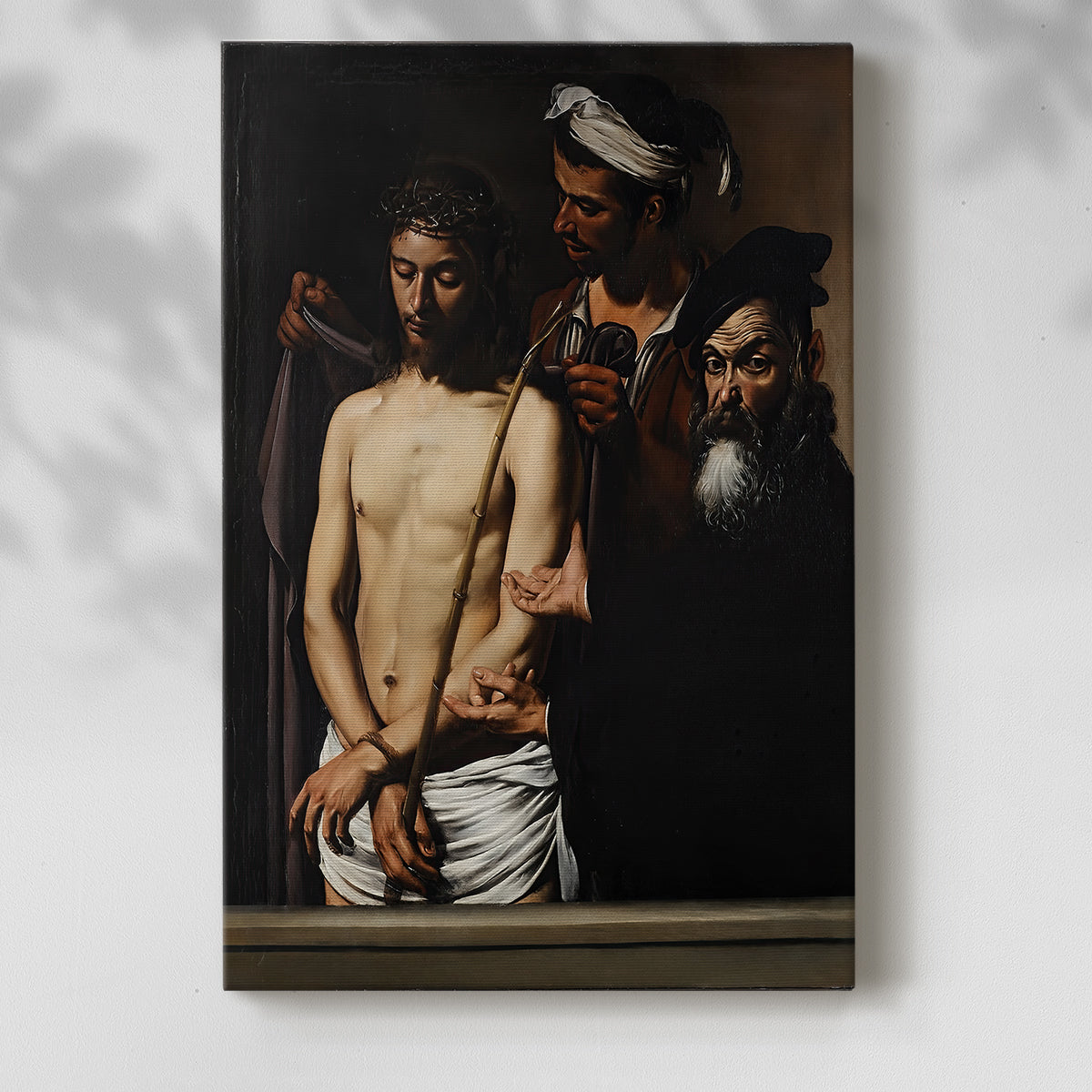 Canvas art print of a religious composition with figures in strong shadow and contrast with a soft shadow on a white background.