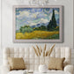 Impressionist wheat field with cypress trees by Vincent van Gogh printed on canvas in an ornate weathered white frame.
