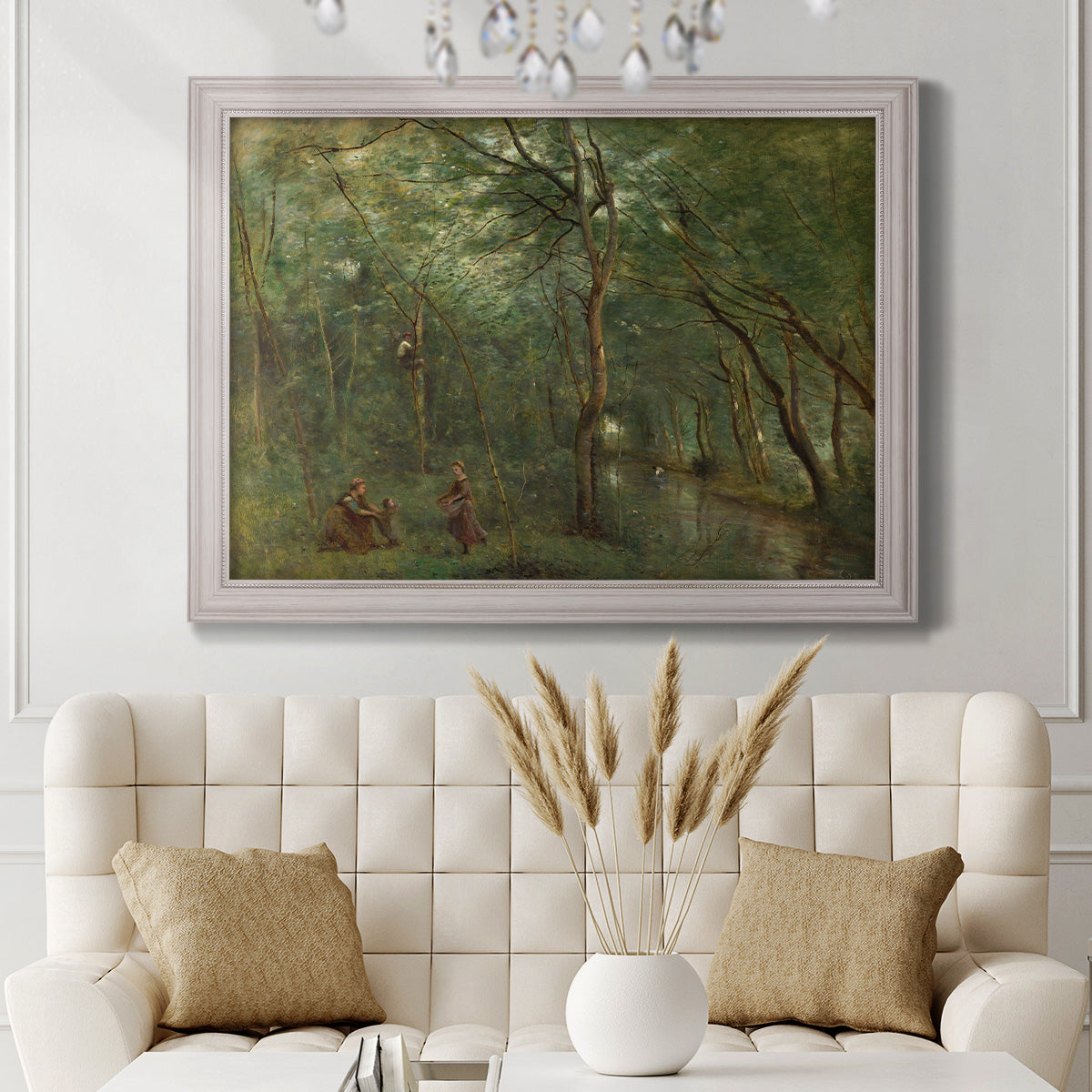 Traditional rural landscape scene with figures by Jean-Baptiste-Camille Corot in an ornate weathered white frame displayed in a neutral-toned interior setting.