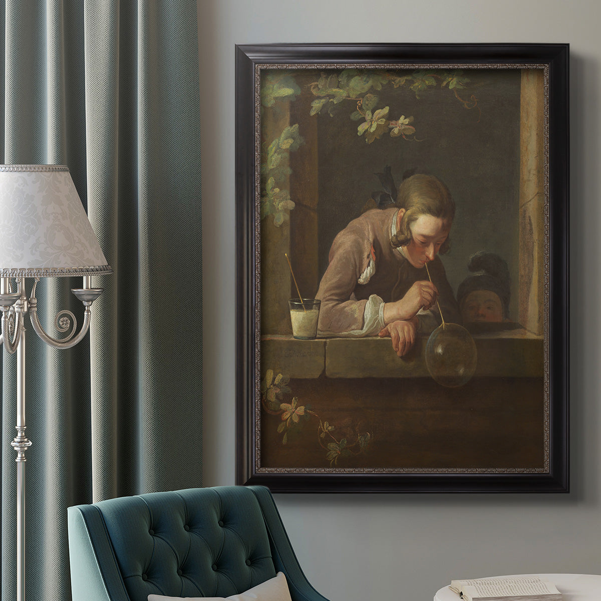 Classical genre painting of a child blowing soap bubbles by Jean-Siméon Chardin in an ornate black frame with gilded inner detail displayed in a neutral interior setting.
