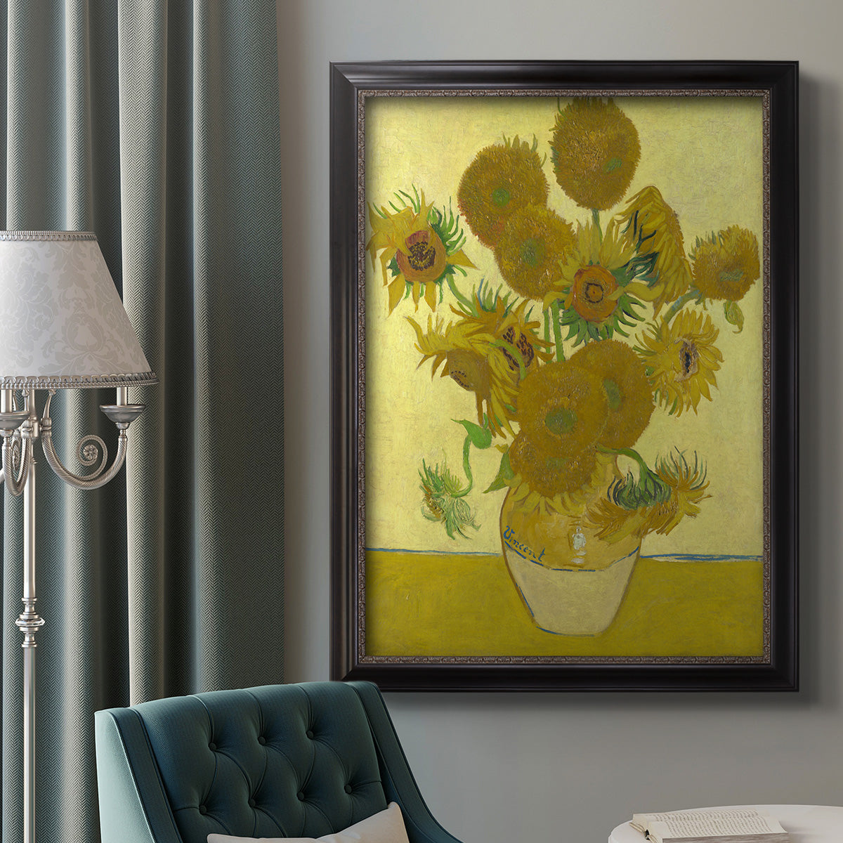 Impressionist sunflower still life painting by Vincent van Gogh in an ornate black frame with gilded inner detail displayed in a neutral interior setting.