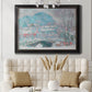 Impressionist coastal village landscape in Norway by Claude Monet in an ornate black frame with gilded inner detail displayed in a neutral-toned interior setting.