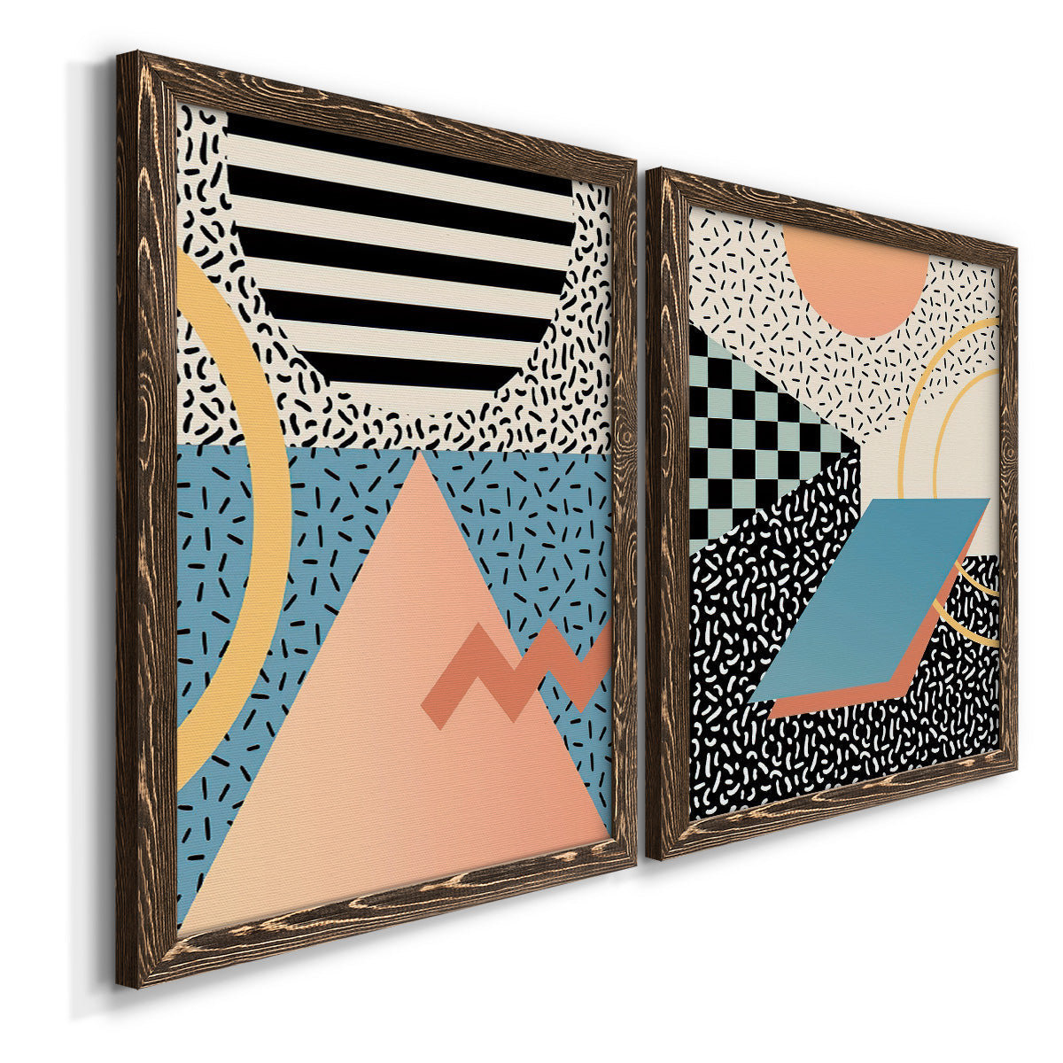 Angled view of a set of two walnut barnwood framed canvas prints featuring two retro graphic abstracts featuring bold geometric Memphis-style patterns.