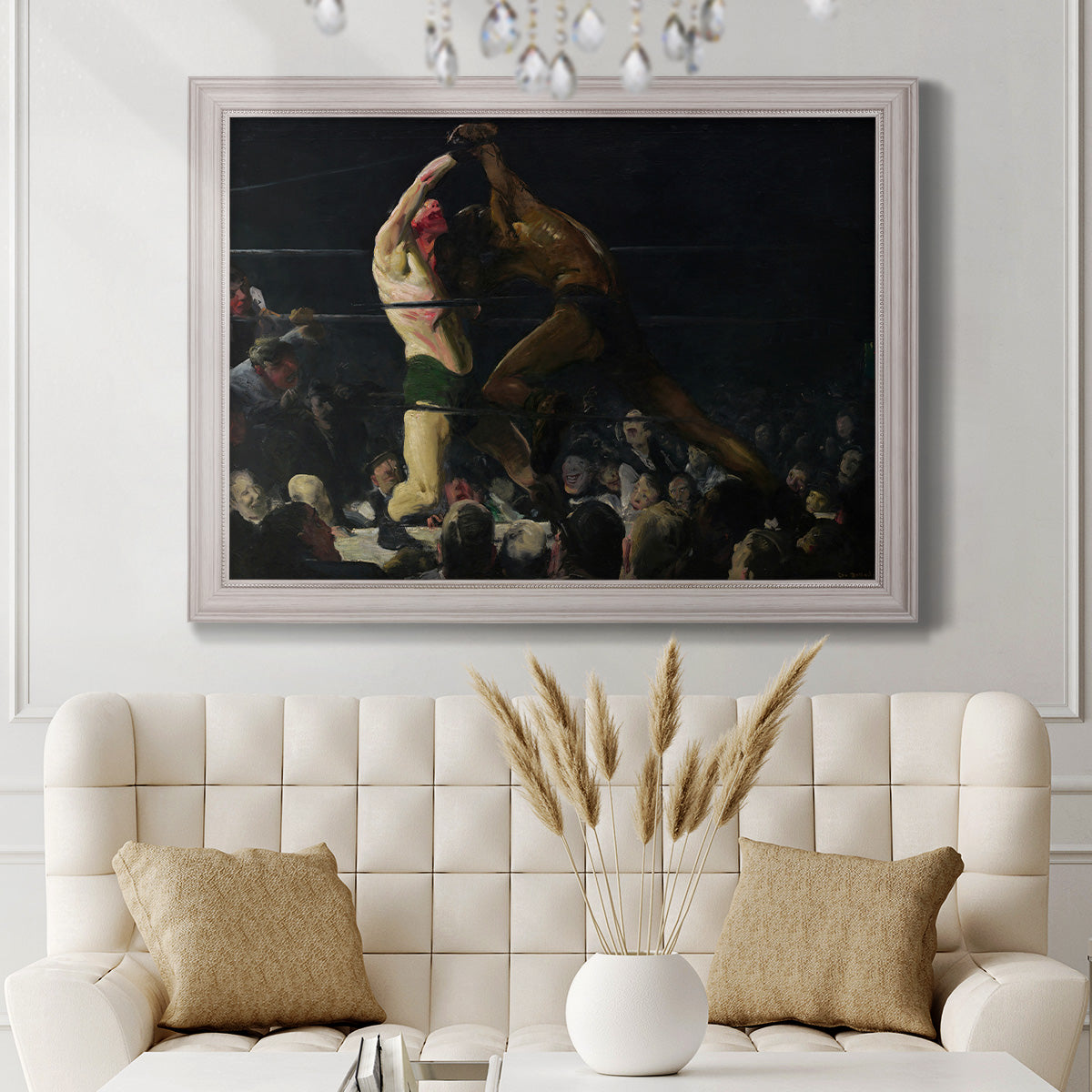 American genre painting of men in a social club by George Bellows in an ornate weathered white frame displayed in a neutral-toned interior setting.