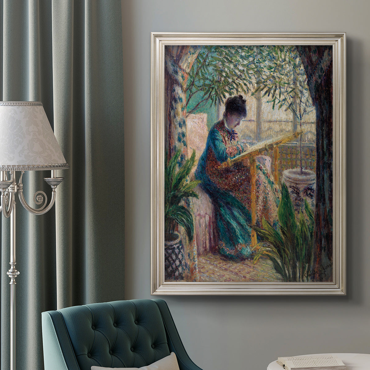 Impressionist portrait of Madame Monet sewing by Claude Monet in an ornate champagne frame displayed in a neutral interior setting.