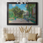 Impressionist residential landscape at Argenteuil by Claude Monet in an ornate black frame with gilded inner detail displayed in a neutral-toned interior setting.