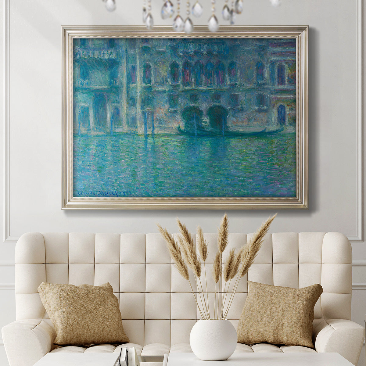 Impressionist Venetian palace waterfront scene by Claude Monet in an ornate champagne frame displayed in a neutral-toned interior setting.