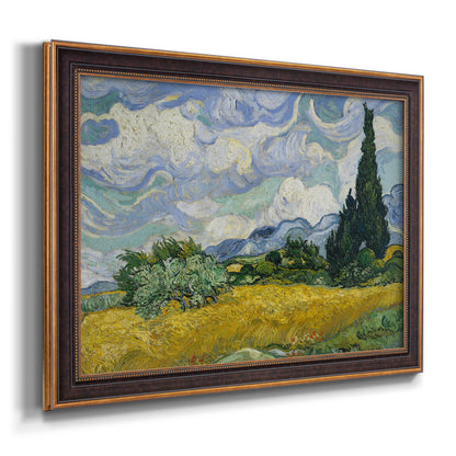 Impressionist wheat field with cypress trees by Vincent van Gogh printed on canvas in an ornate bronzed mahogany wood frame.