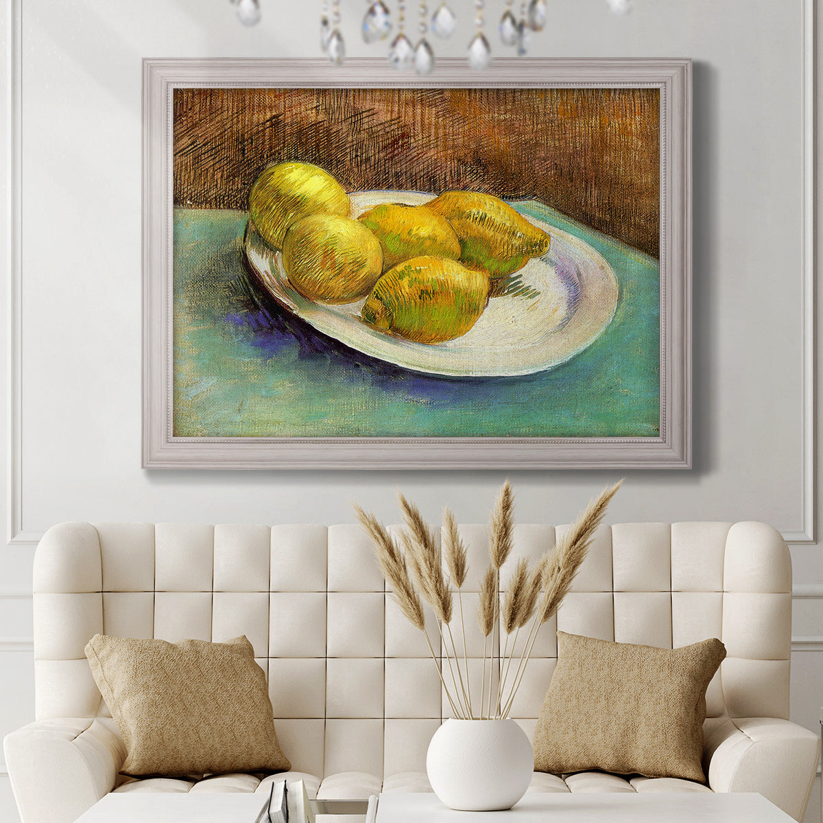 Impressionist still life with lemons by Vincent van Gogh in an ornate weathered white frame displayed in a neutral-toned interior setting.