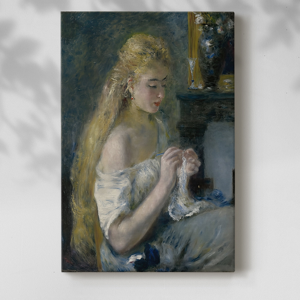 Canvas art print of a seated figure working with yarn in soft natural light with a soft shadow on a white background.