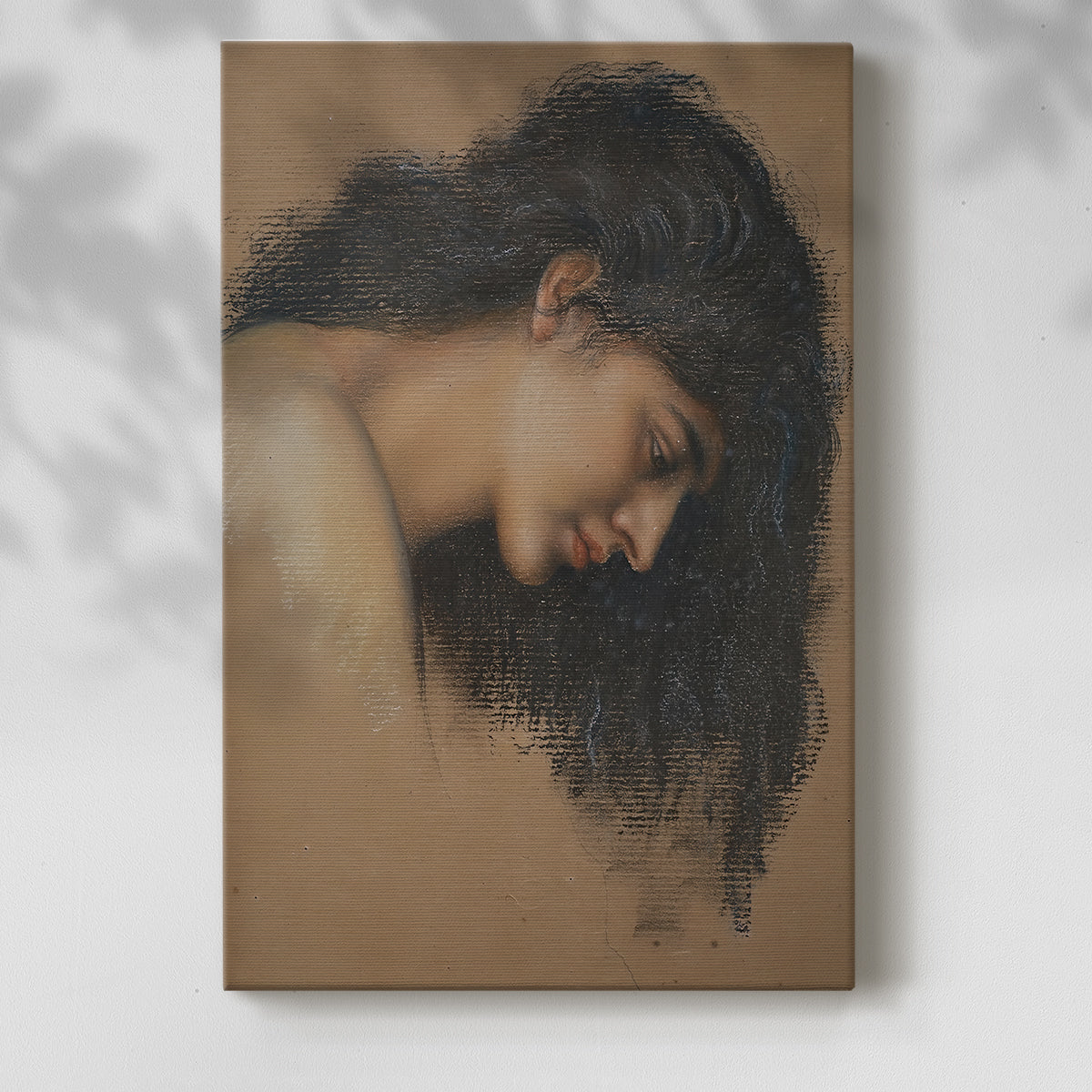 Canvas art print of a delicate portrait focusing on expression and subtle shading with a soft shadow on a white background.