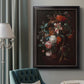 Classical floral still life painting by Jan van Huysum in an ornate black frame with gilded inner detail displayed in a neutral interior setting.
