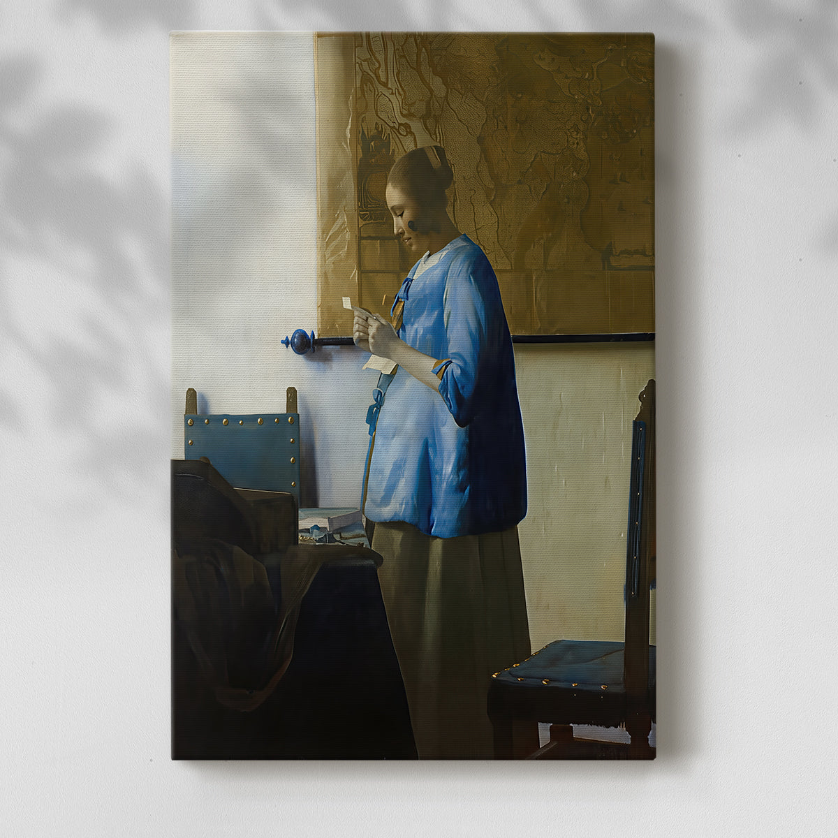Canvas art print of a calm figure with soft window light and simple background with a soft shadow on a white background.