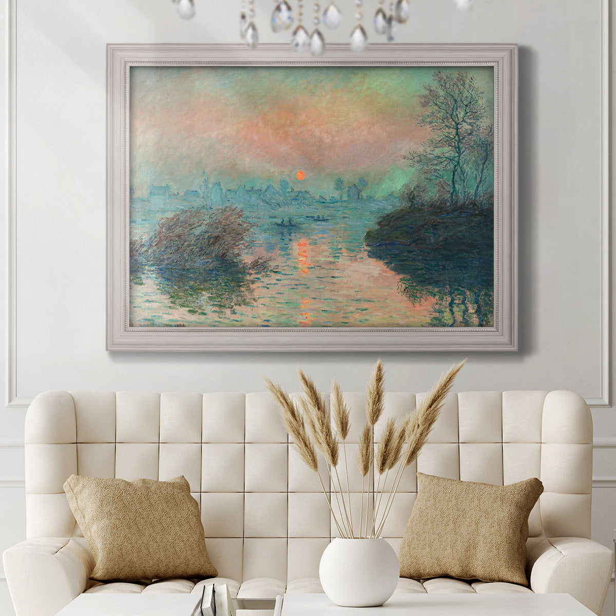 Impressionist winter river sunset scene by Claude Monet in an ornate weathered white frame displayed in a neutral-toned interior setting.