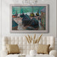 Impressionist coastal beach scene with boats by Claude Monet in an ornate weathered white frame displayed in a neutral-toned interior setting.