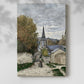 Canvas art print of a coastal town street with light tones and loose brushwork with a soft shadow on a white background.