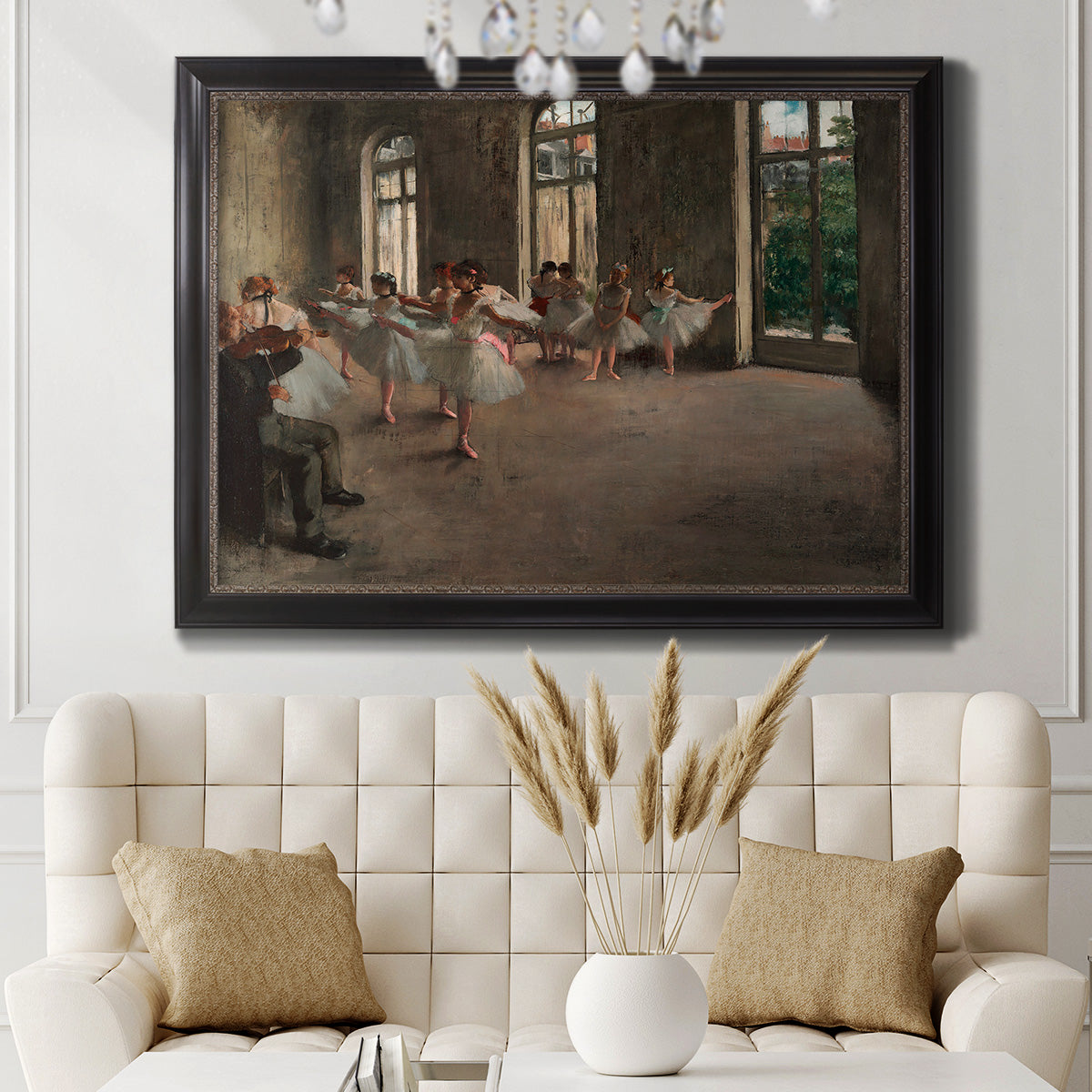 Early impressionist ballet rehearsal painting by Edgar Degas in an ornate black frame with gilded inner detail displayed in a neutral-toned interior setting.