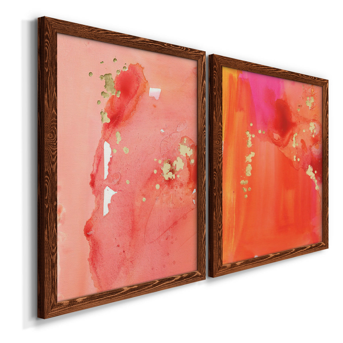 Angled view of a set of two maple barnwood framed canvas prints featuring two glamorous fluid abstracts featuring luminous coral orange and pink color fields with gold flecks.