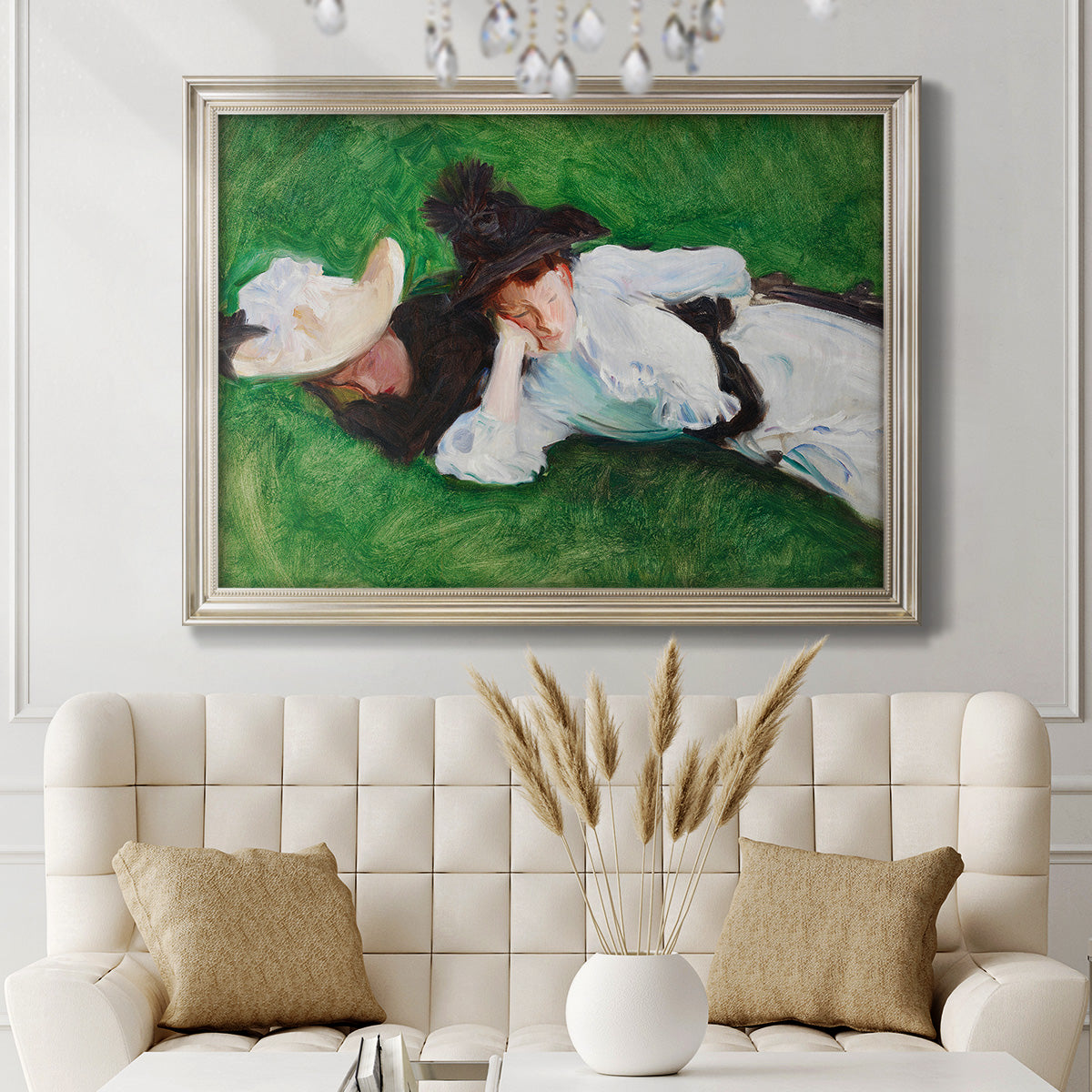 Impressionist outdoor portrait of two girls by John Singer Sargent in an ornate champagne frame displayed in a neutral-toned interior setting.
