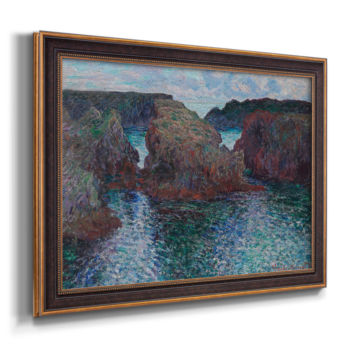 Impressionist rocky seascape by Claude Monet printed on canvas in an ornate bronzed mahogany wood frame.