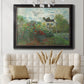 Impressionist garden landscape at Argenteuil by Claude Monet in an ornate black frame with gilded inner detail displayed in a neutral-toned interior setting.
