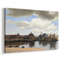 Canvas art print featuring an urban landscape with waterfront and architecture, displayed at an angle