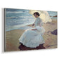 Canvas art print featuring a sunlit coastal portrait of woman near shoreline, displayed at an angle