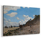 Canvas art print featuring an impressionist seaside with people and sailboats under bright sky, displayed at an angle